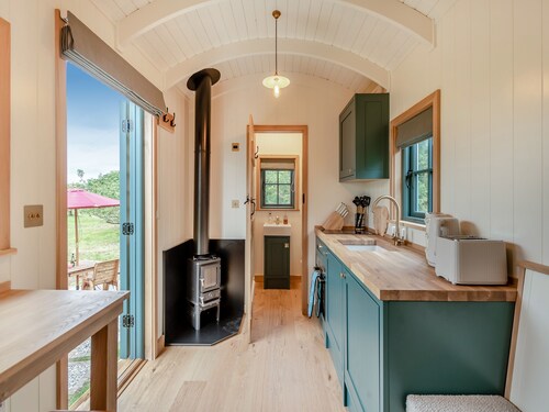 Set among the fruit trees with views of the fields.