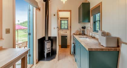 Set among the fruit trees with views of the fields.