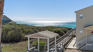 A coastal property with a wooden deck, a gazebo, and a view of the ocean. - Ocean front: Private Pool + Private Beach Access (Seagrove Beach)