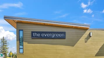 A building with a sign reading "the evergreen."