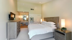 A bedroom with a bed, bedside tables, a dresser, and a mirror. - Napa Golf Course Condo - 2 King Suites + En-Suite Baths - Perfect for 2 couples (Napa)