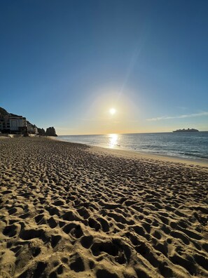 On the beach, sun loungers, beach towels