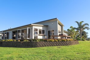 Relax on the spacious porch or enjoy the beautifully maintained lawn.