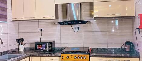 Family Room, Balcony, City View | Private kitchen