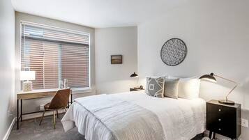 1 bedroom, desk, iron/ironing board, travel crib