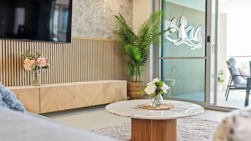 Premium Three Bedroom Ocean View Apartment | Living room | 50-inch TV with satellite channels, streaming services