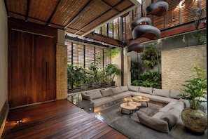 Luxury Villa, 5 Bedrooms, Kitchen, Garden View | Living room | 20-inch flat-screen TV with satellite channels - The Hollow Villa by Betterplace (Canggu)