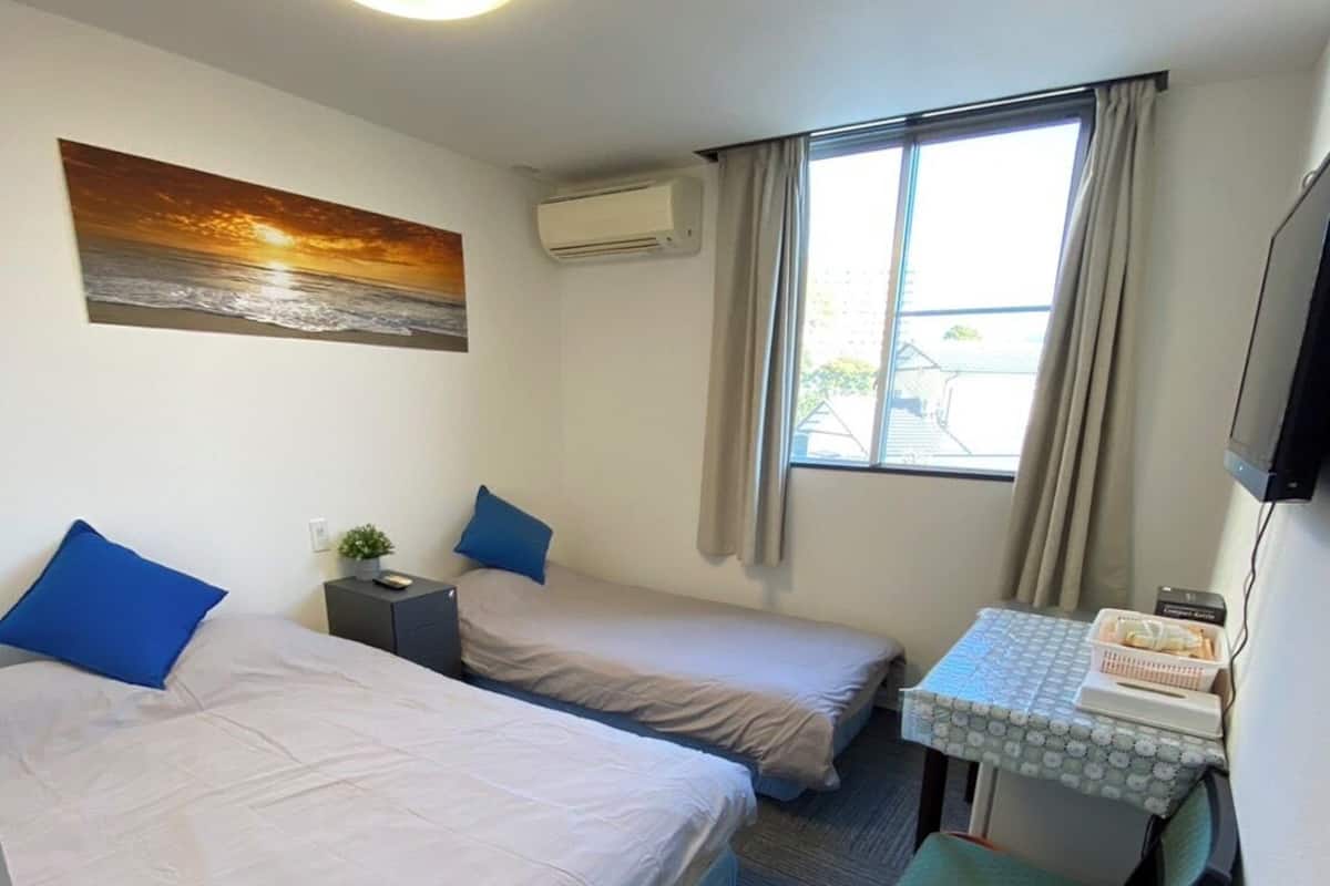 Economy Twin Room, Partial Lake View | Individually decorated, free WiFi, bed sheets