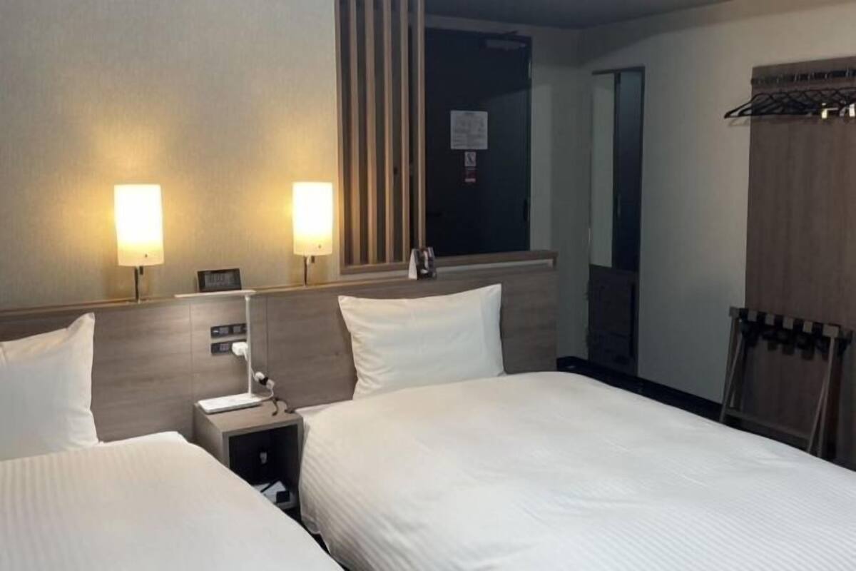 Desk, laptop workspace, blackout drapes, iron/ironing board