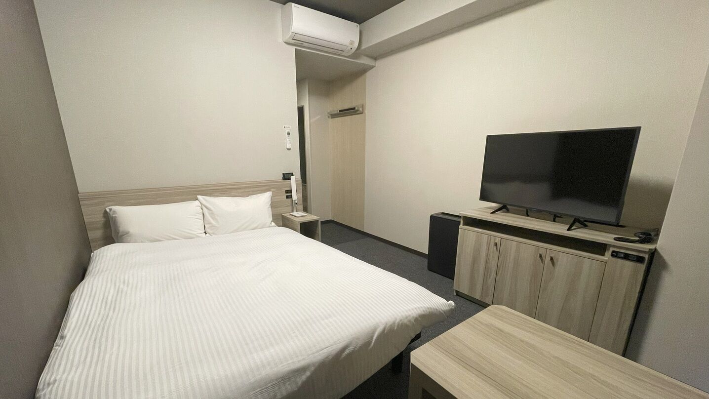 Desk, laptop workspace, blackout drapes, iron/ironing board