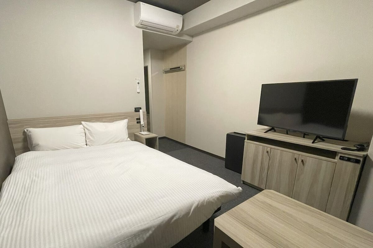 Desk, laptop workspace, blackout drapes, iron/ironing board