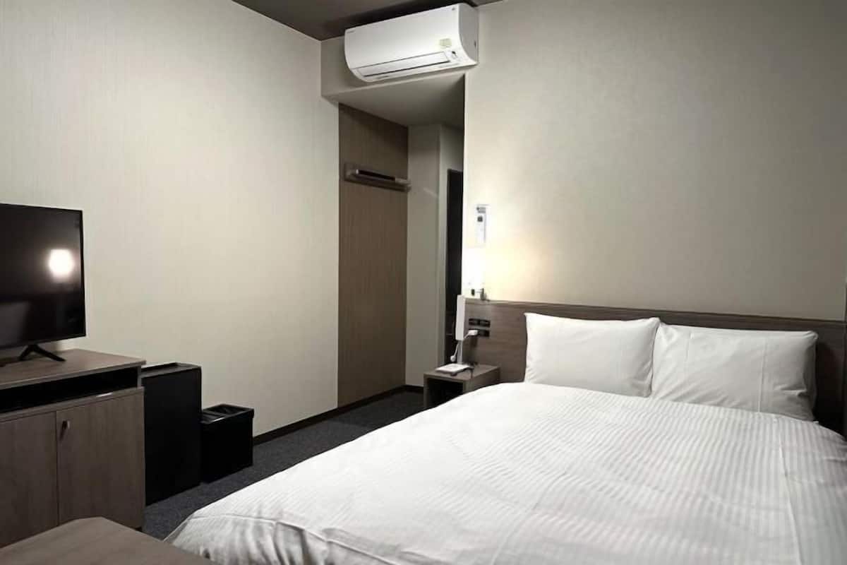 Desk, laptop workspace, blackout drapes, iron/ironing board