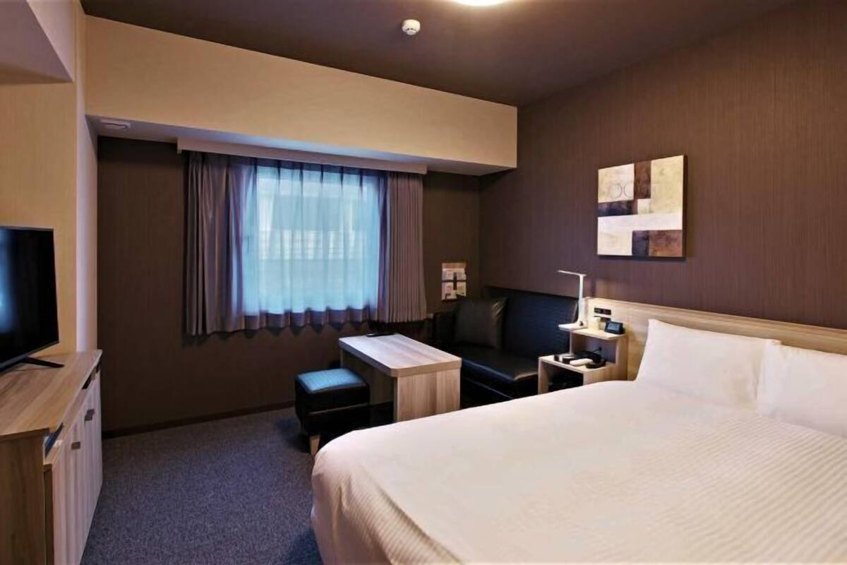 Desk, laptop workspace, blackout drapes, iron/ironing board