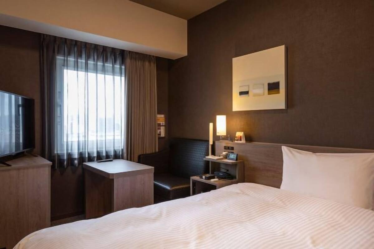 Desk, laptop workspace, blackout drapes, iron/ironing board