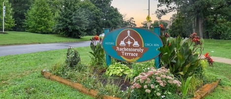 A sign for Auchentory Terrace with a historical marker indicating its establishment around 1876.