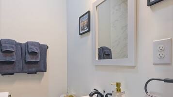 Hair dryer, towels, soap, toilet paper