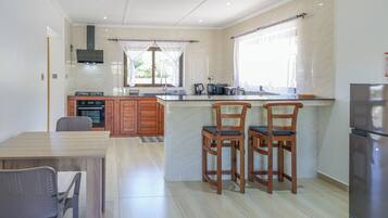 Deluxe Apartment, 1 Bedroom, Garden View | Private kitchen | Full-sized fridge, microwave, oven, stovetop