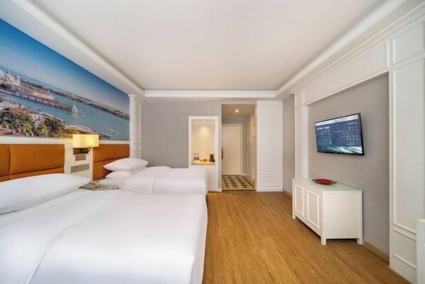 A hotel room with a large bed, a television, and a painting of a cityscape. - Vienna Classic Hotel (Hefei Economic Development Zone Normal University Branch) (Hefei)