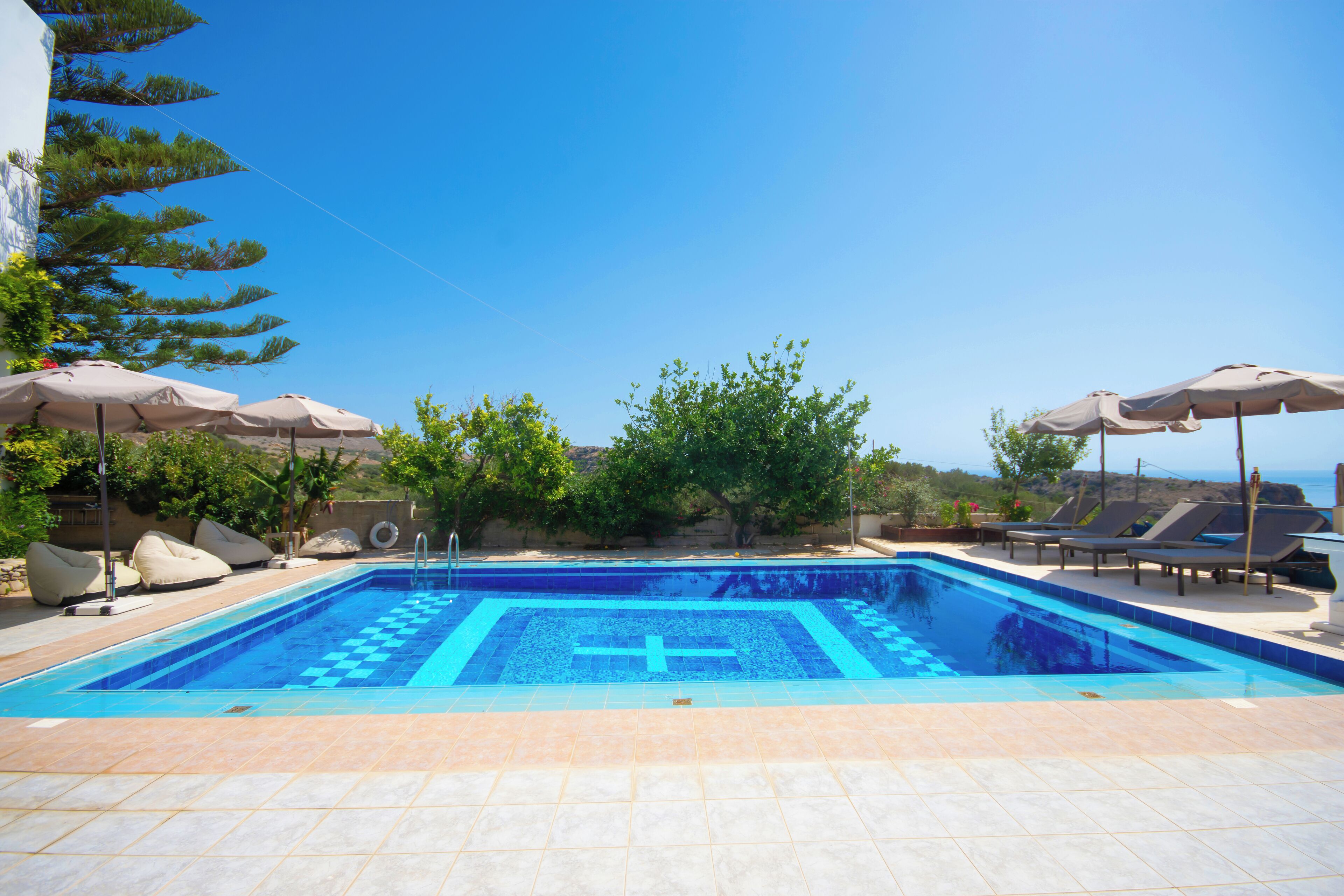 Outdoor pool, open 9:00 AM to 6:00 PM, pool umbrellas, pool loungers