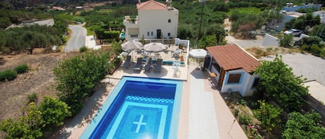Outdoor pool, open 9:00 AM to 6:00 PM, pool umbrellas, pool loungers