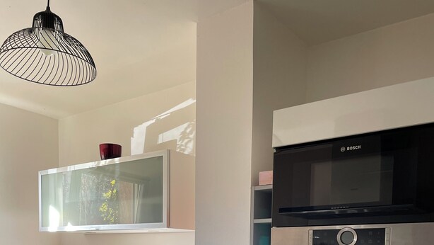 A modern kitchen with stainless steel appliances, a dishwasher, and a Bosch microwave. - Peaceful, air-conditioned villa near Montpellier, sea and river. Pets allowed (Saint-Gély-du-Fesc)