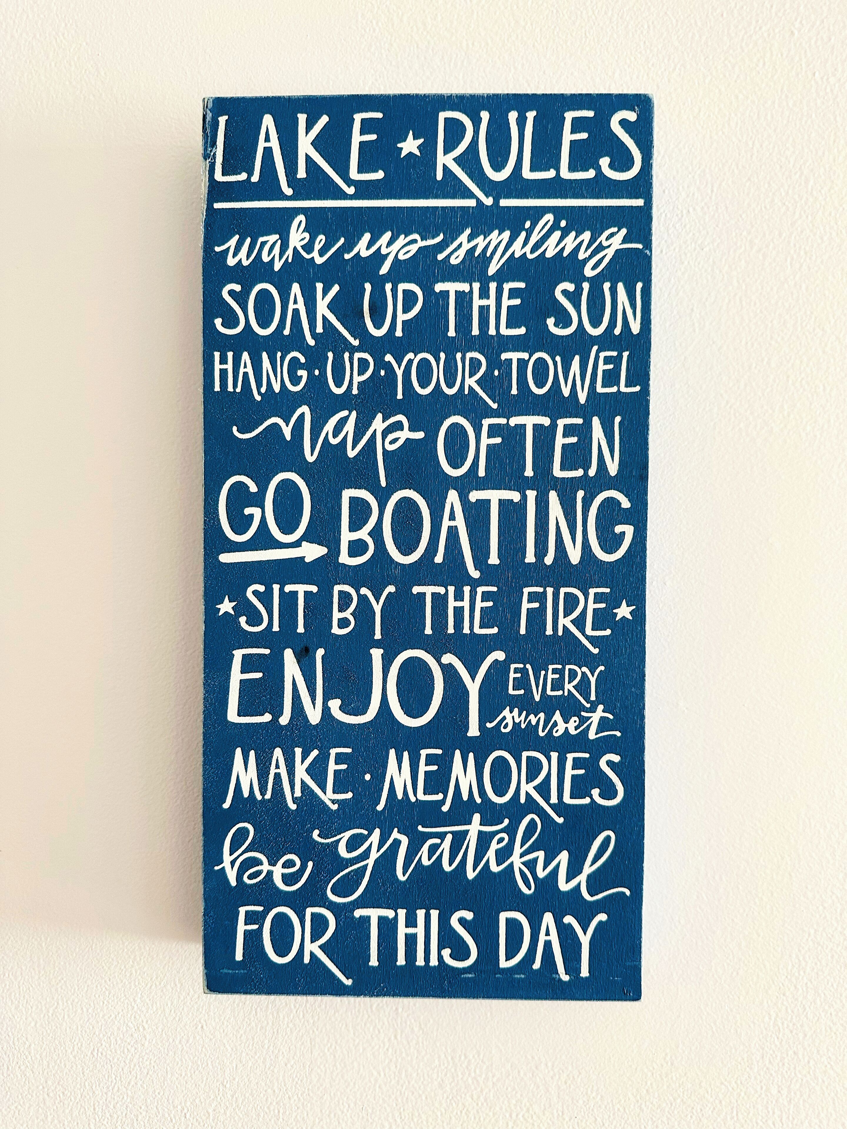 A blue sign with white text offering various activities and sentiments for the day.