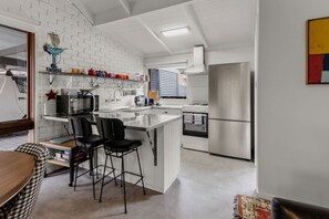 Fridge, coffee/tea maker, cookware/dishes/utensils