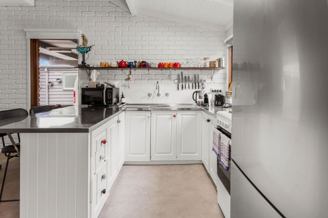 Fridge, coffee/tea maker, cookware/dishes/utensils