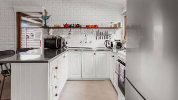 Fridge, coffee/tea maker, cookware/dishes/utensils