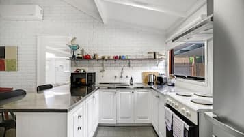 Fridge, coffee/tea maker, cookware/dishes/utensils