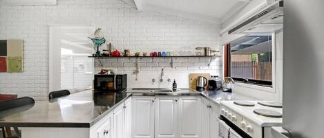 Fridge, coffee/tea maker, cookware/dishes/utensils