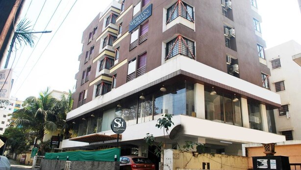 A multi-story building with a sign reading "SHORELINE HERITAGE." - Shoreline Heritage (Pune)
