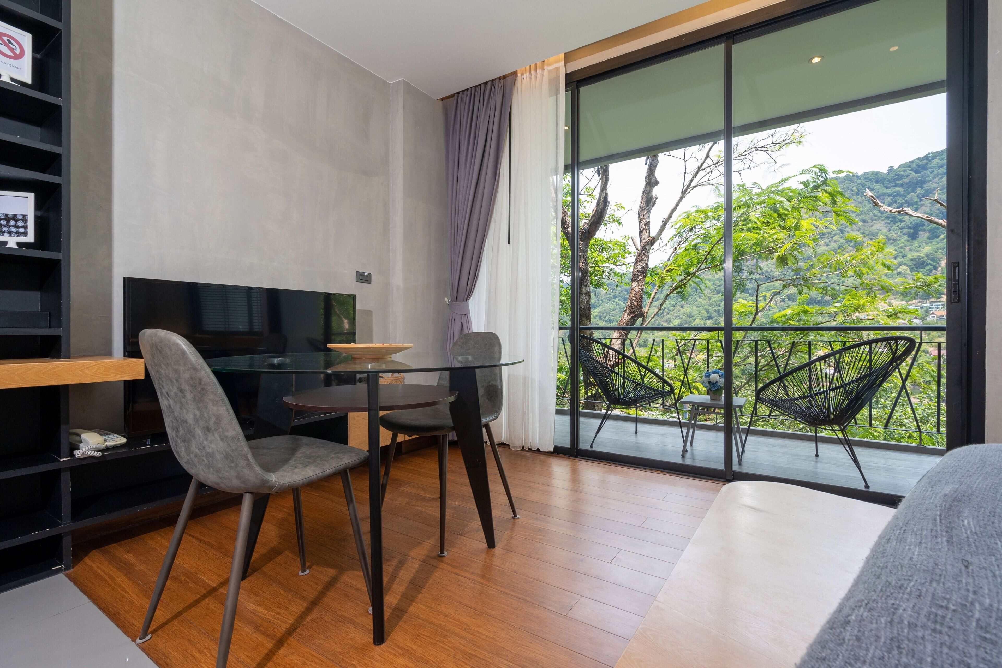 Design Studio Suite, Balcony, Garden View | Living area | Flat-screen TV