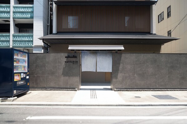 A building entrance with a sign reading "WAYFARER". - WAYFARER Gojo (Kyoto)