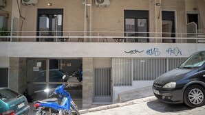 A building with two air conditioning units, a blue scooter, and a black car parked in front. - Ag. Ioannis m. station 1 bed for 2 pers by MPS (Vironas)