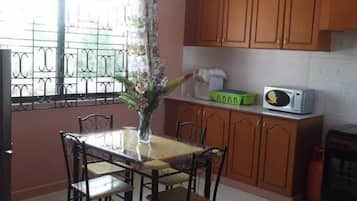 Family Villa, Balcony, Garden View | Private kitchen | Fridge, microwave, cookware/dishes/utensils, dining tables