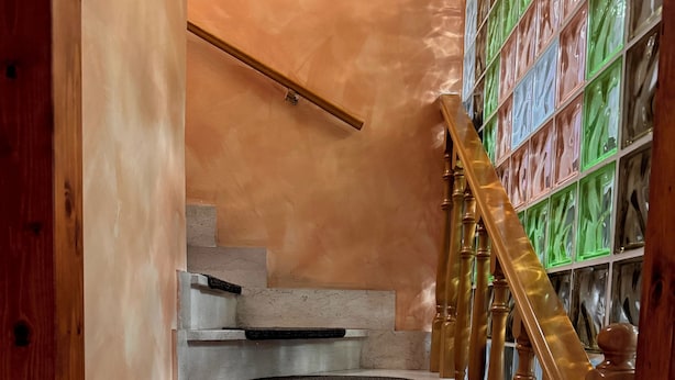 A staircase with wooden railings and a series of steps. - la villetta fiera airport (Rome)