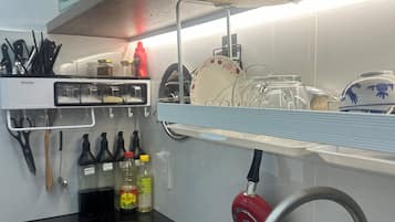 Deluxe Room, 1 King Bed | Private kitchen | Full-size fridge, microwave