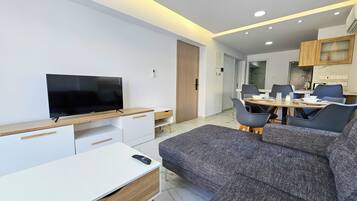 Appartement Standard | Coin séjour | Télévision à écran plat