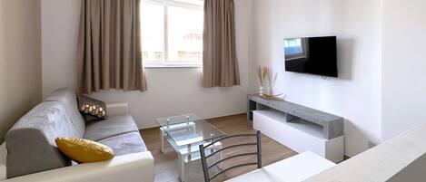 Two Bedroom Apartment | Living area | 32-inch flat-screen TV with digital channels