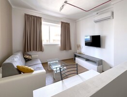 Two Bedroom Apartment | Living area | 32-inch flat-screen TV with digital channels