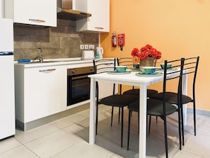 One Bedroom Apartment | Living area | 32-inch flat-screen TV with digital channels - Miami Apartments (St. Julian's)