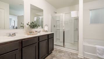 Shower, hair dryer, towels, shampoo