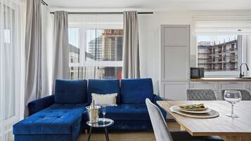 Deluxe Apartment | Living area | TV