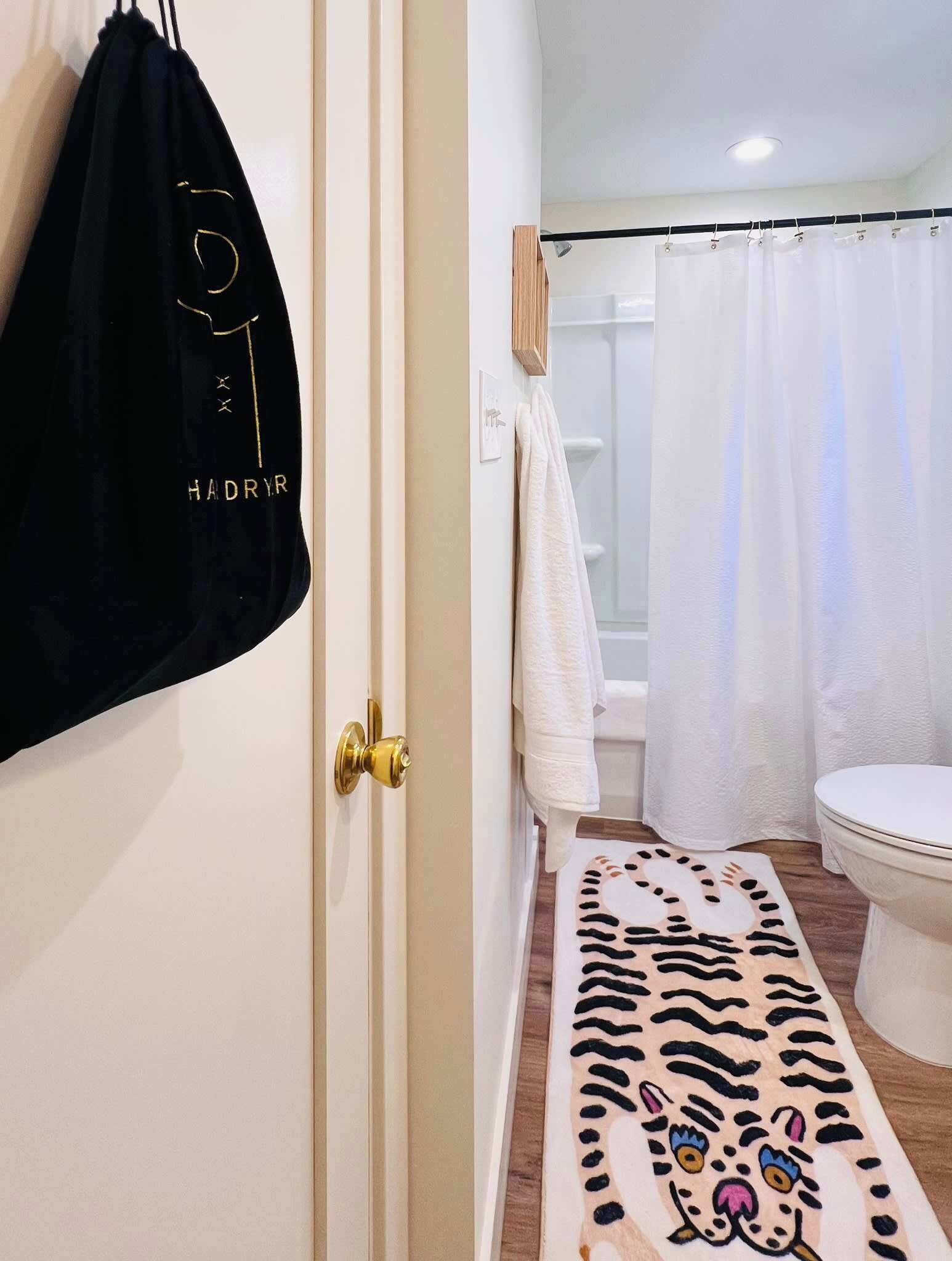 Shower, hair dryer, towels, shampoo