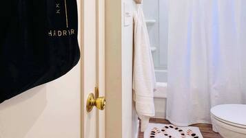 Shower, hair dryer, towels, shampoo
