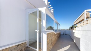 A narrow corridor with a glass door leading to a balcony. - Luxurious Villa La Vita e Bella Escape in Murcia (Murcia)