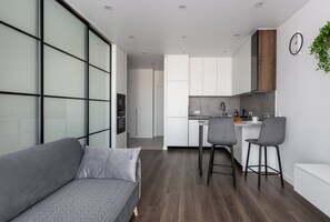 Comfort Studio, City View | Living area | 20-inch TV with satellite channels - Stylish studio near the National Library (Minsk)