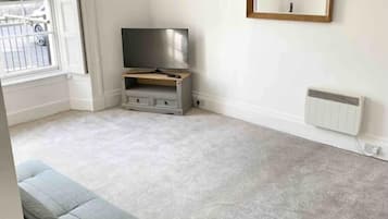 Apartamento | Área de estar | TV