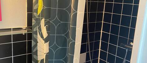 Shower, towels, soap, toilet paper